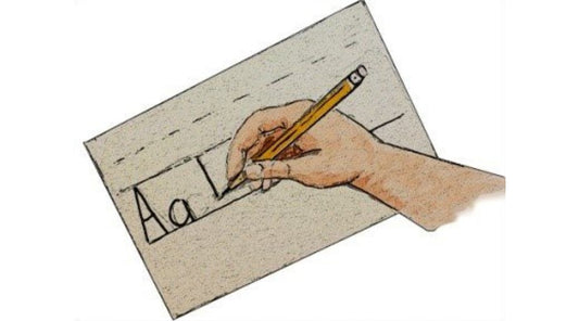 sketch of hand with pencil writing the alphabet